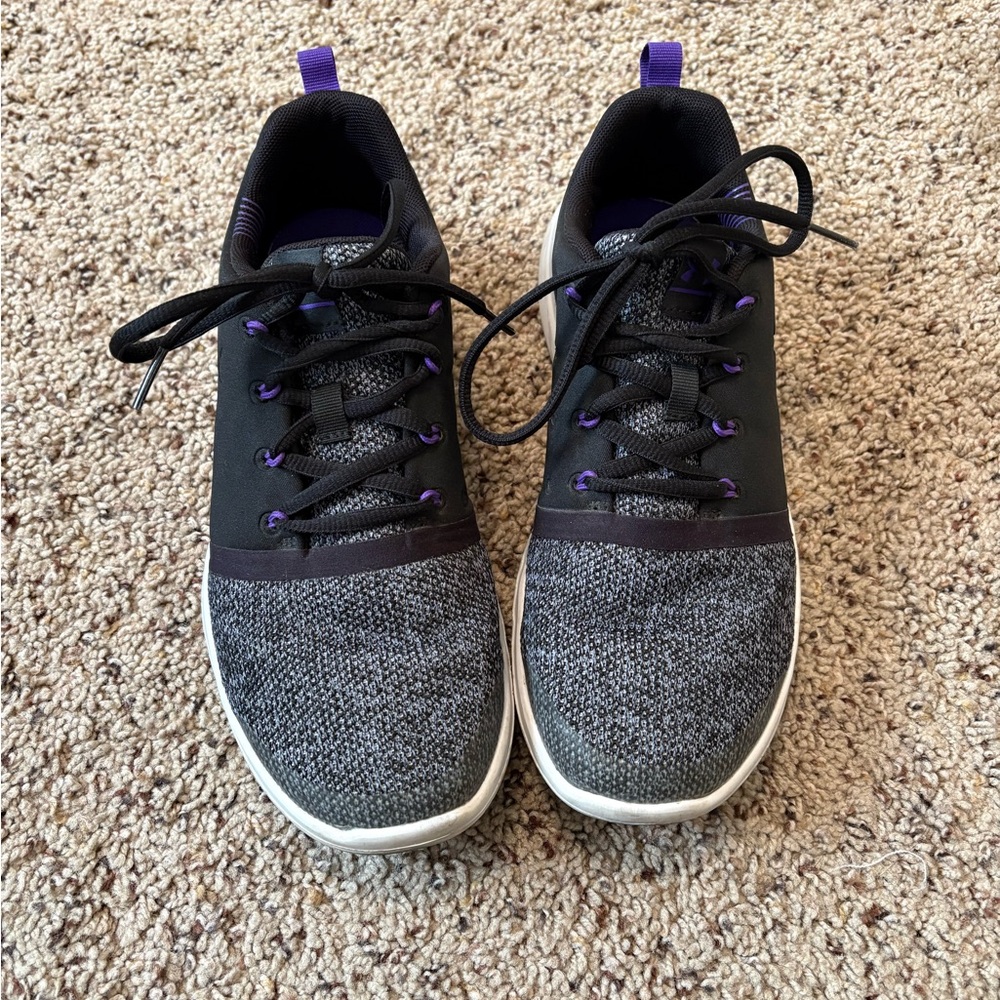 Black and purple youth Under Armour tennis shoes, size 7Y